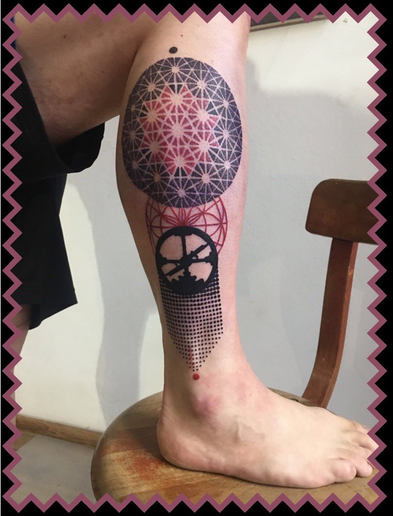 A leg tattoo: a sacred-geometry mandala above the Roam Research logo.